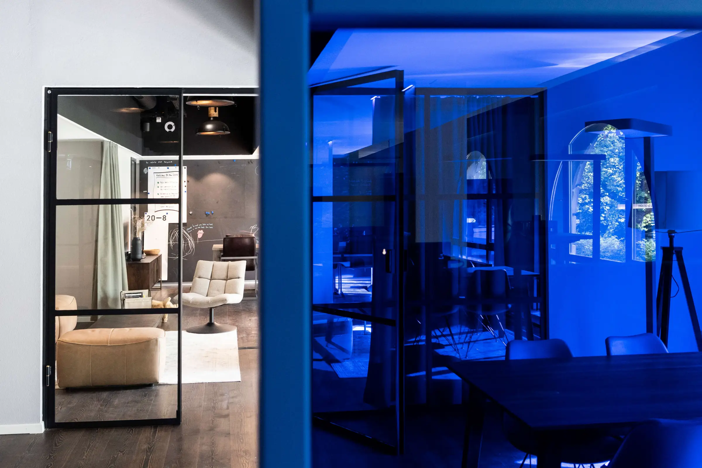 The Monostream office in Zürich, seen through its blue glass meeting room